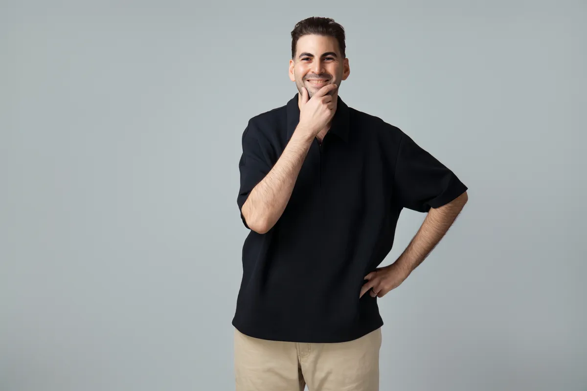 Usef Waly in a black polo shirt, smart casual look for casting reference
